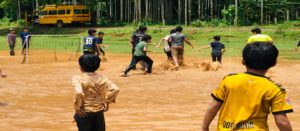 Students and principal play football outdoor at the best school in Calicut the Oxford School Calicut